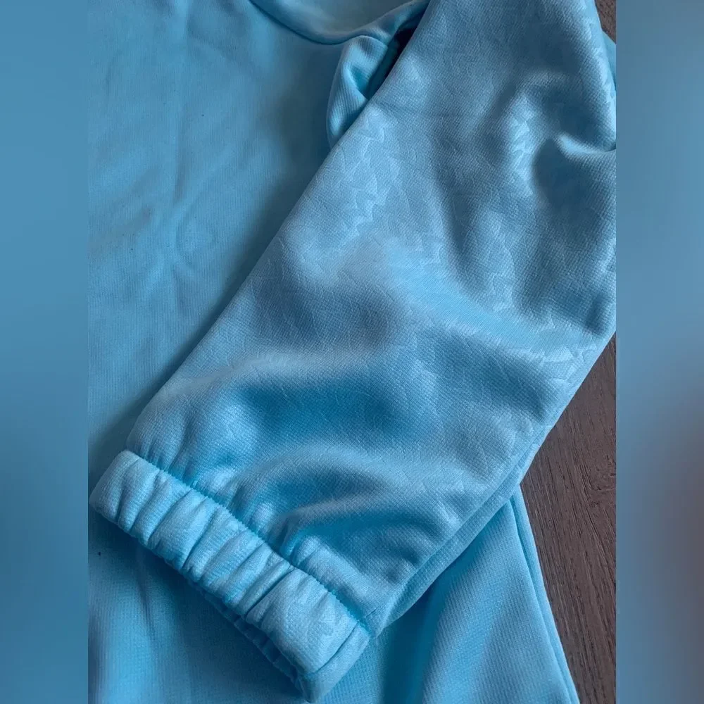 Under Armour girls sweater color baby blue. NWOT